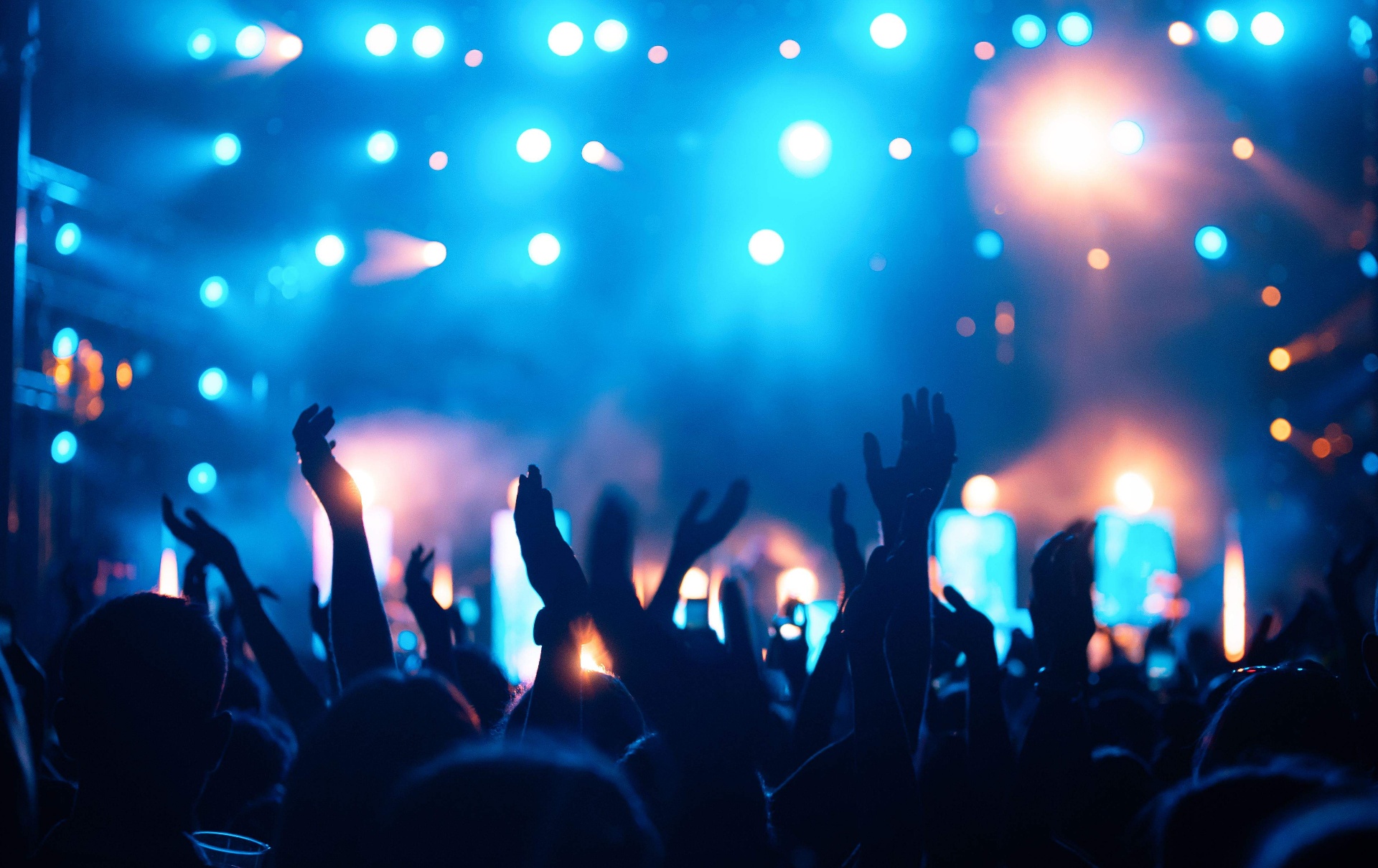 Audience facing a lit stage at a go-to-market summit